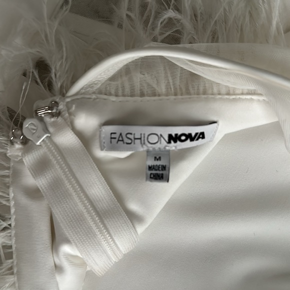 White jumpsuit. Fashion Nova size M. Worn twice. Feathers on the top. - Picture 2 of 3